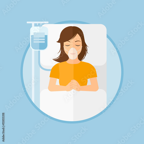 Patient lying in hospital bed with oxygen mask.