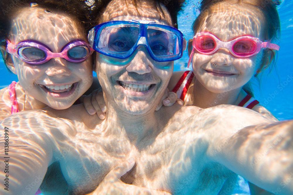 family in swimming pool