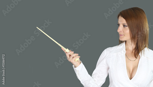 sexy witch holding a magic wand