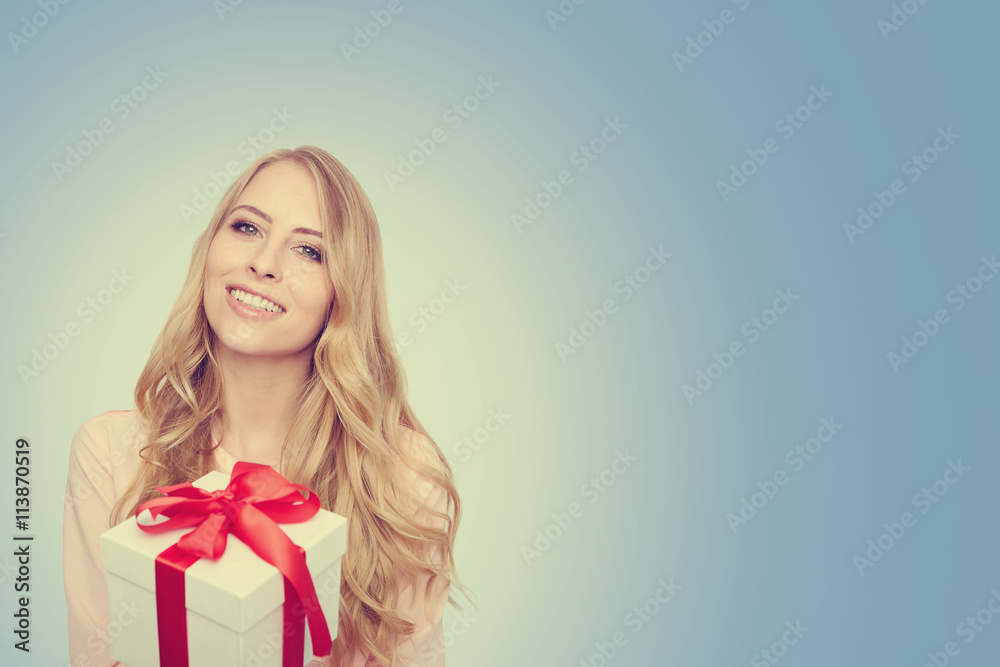 Young woman happy smile hold gift box in hands.