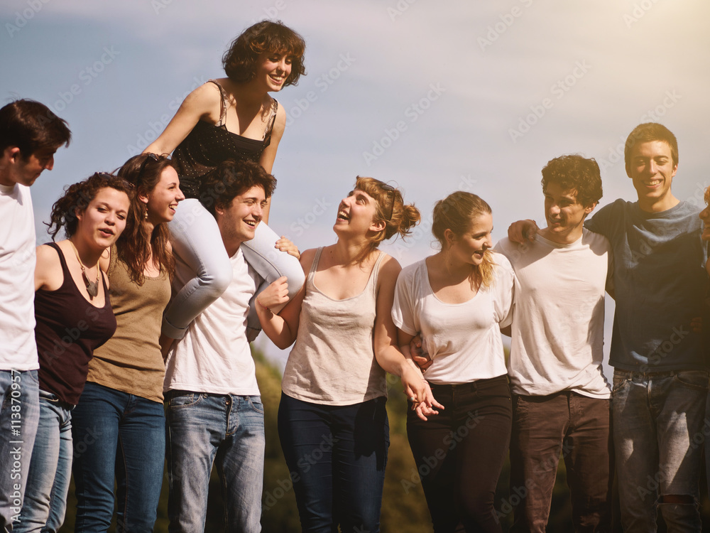 large group of friends tohether in a park having fun large group of friends tohether in a park having fun