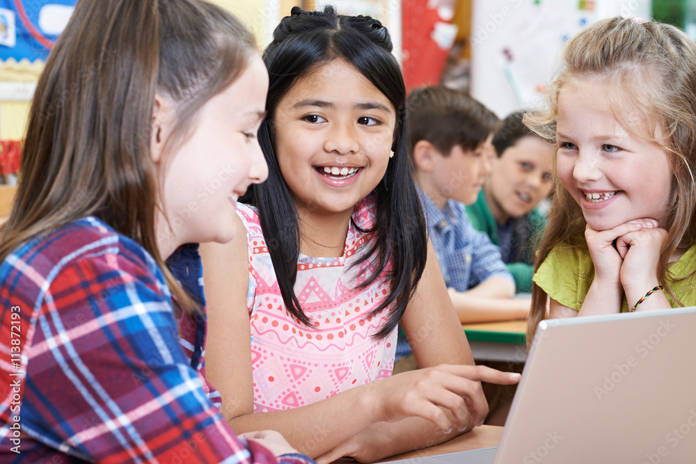 Group Of Elementary School Children Working Together In Computer Group Of Elementary School Children Working Together In Computer