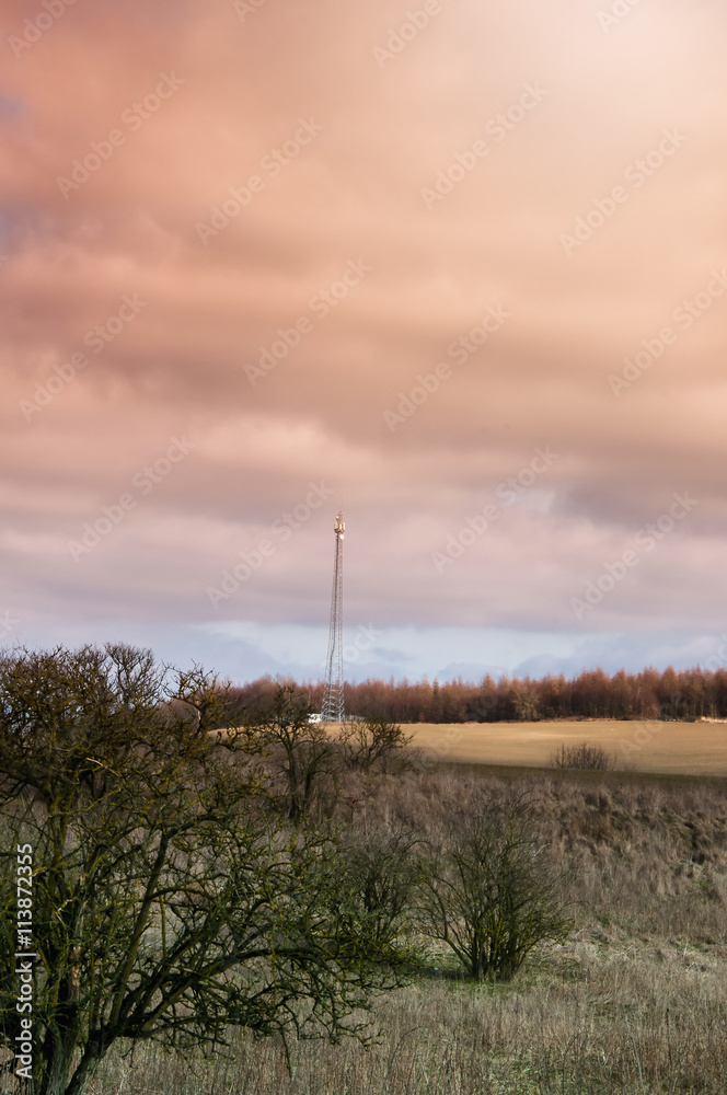 The image of phone tower in a small village The image of phone tower in a small village