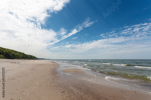 Blue cloudy sky over seashore