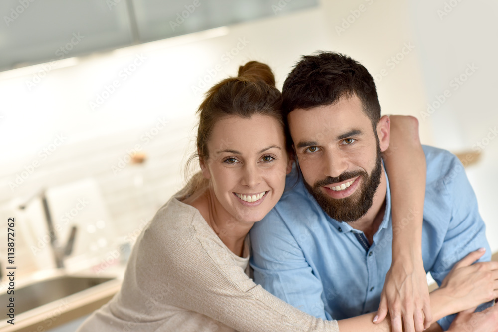 Cheerful hipster couple embracing each other