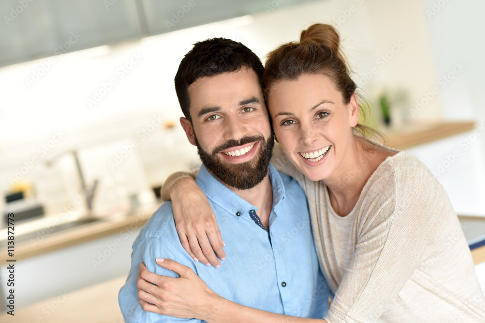 Cheerful hipster couple embracing each other Cheerful hipster couple embracing each other