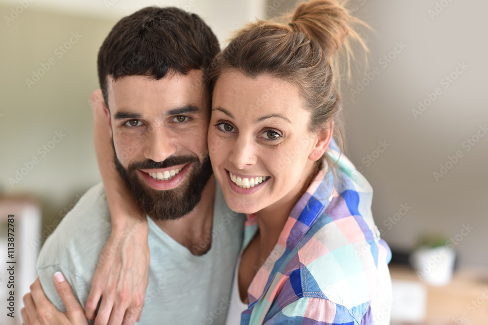 Cheerful hipster couple embracing each other Cheerful hipster couple embracing each other