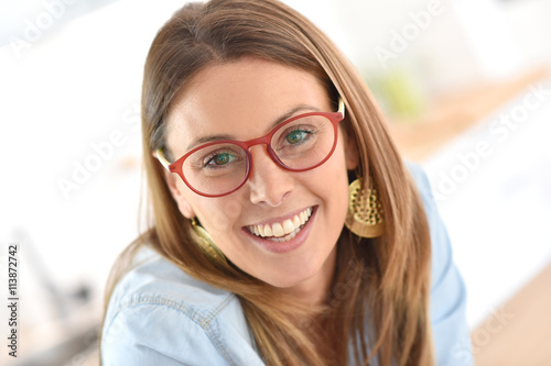 Portrait of beautiful young woman with eyeglasses