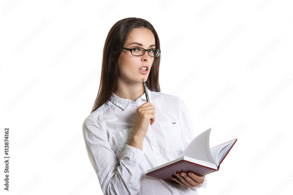 Young attractive girl with glasses holding diary in hands. Young attractive girl with glasses holding diary in hands.