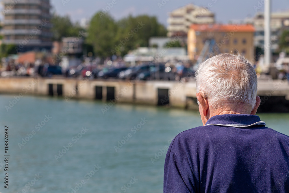 Fototapeta premium old man with a hearing aid