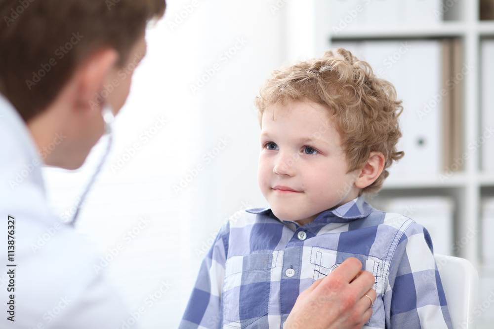 Doctor examining a child patient by stethoscope. Health care o Doctor examining a child patient by stethoscope. Health care o