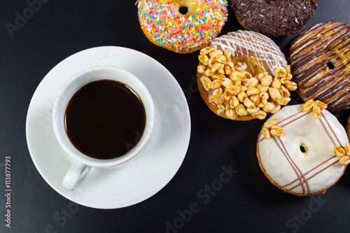 donut and coffee on the black background