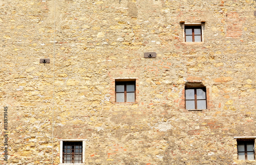 The small windows in the medieval castle.