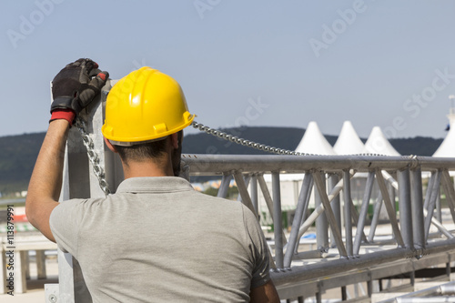 workers building stage construction