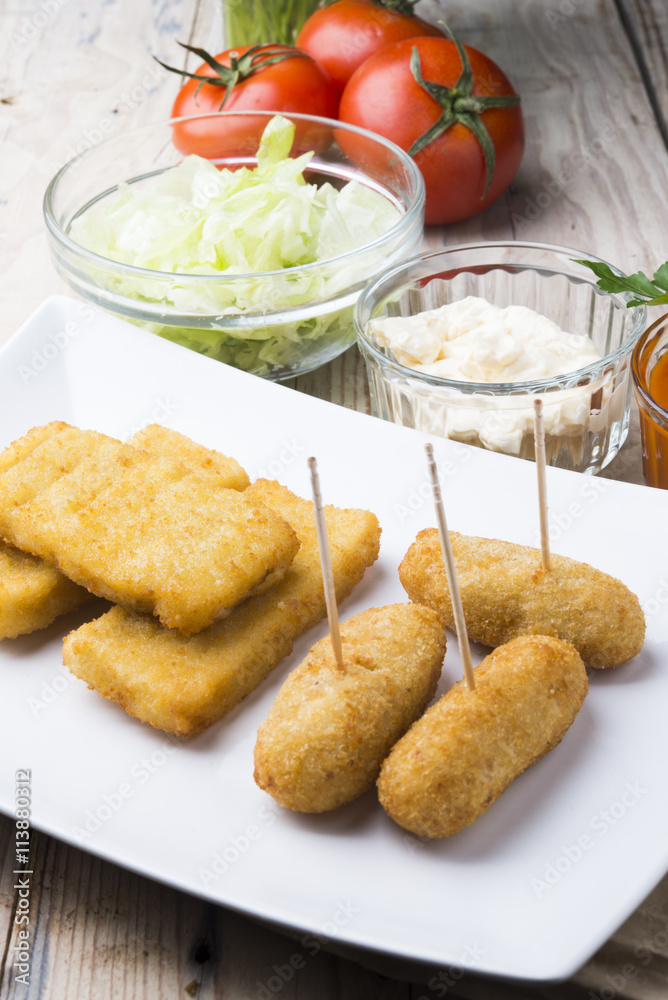 croquettes balls and different kind of sauces on a plate on a cl croquettes balls and different kind of sauces on a plate on a cl