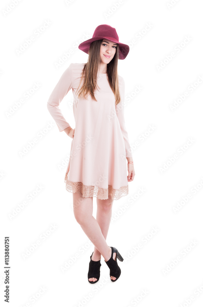 Fashionable girl with modern hat and stylish outfit posing Fashionable girl with modern hat and stylish outfit posing