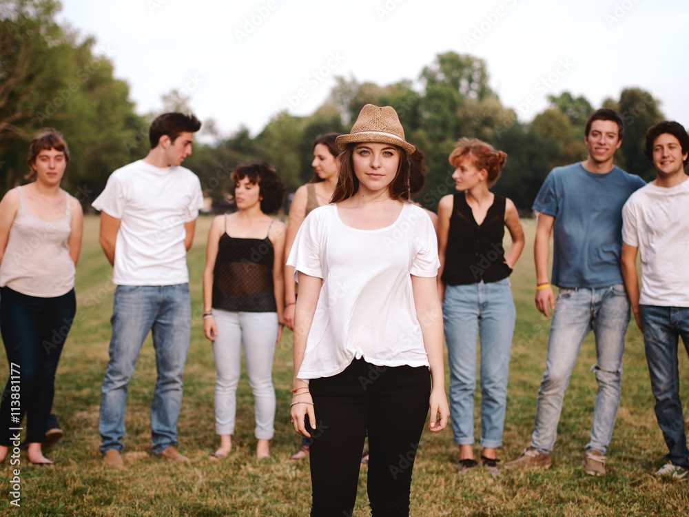 large group of friends together in a park having fun, back to school