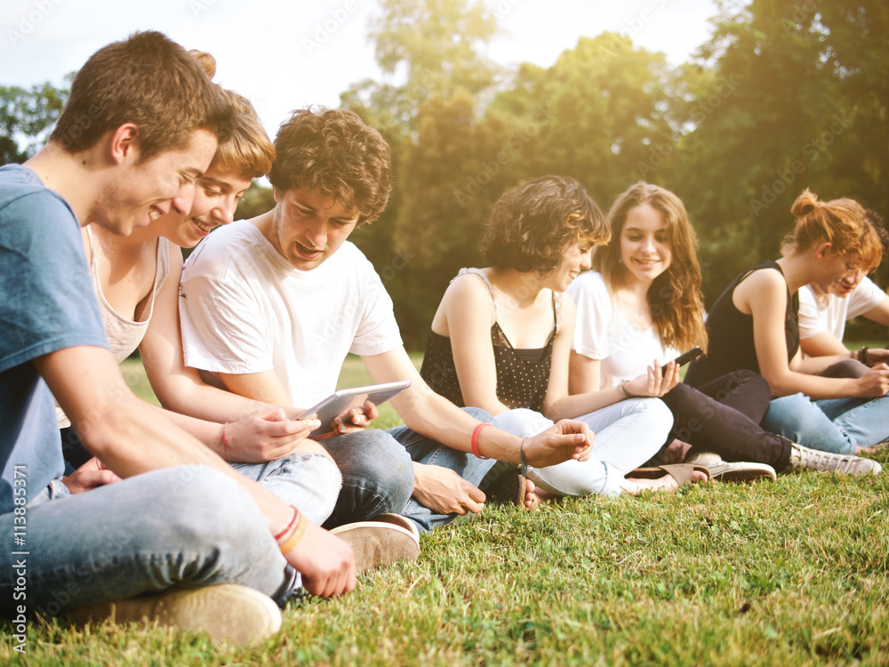 large group of friends tohether in a park having fun large group of friends tohether in a park having fun
