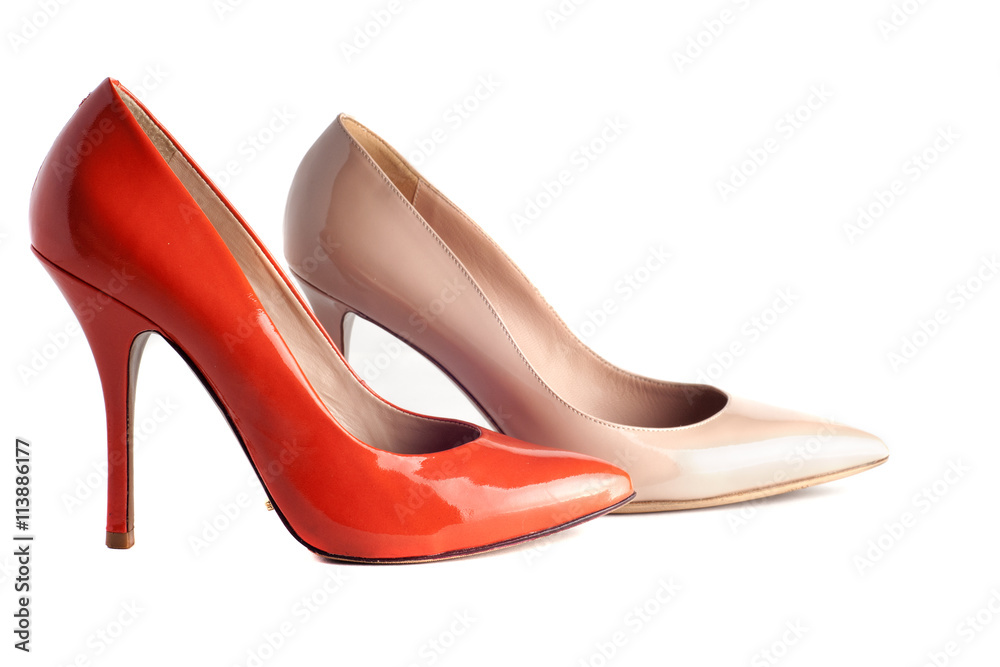 bright, multicolored female shoes on high heels isolated on white background bright, multicolored female shoes on high heels isolated on white background