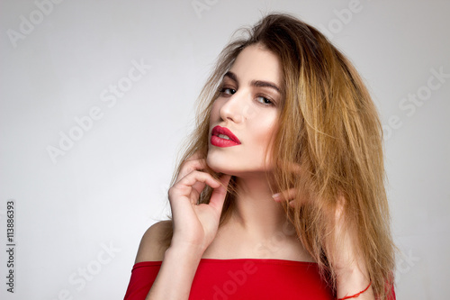 woman with red lips looking at the camera