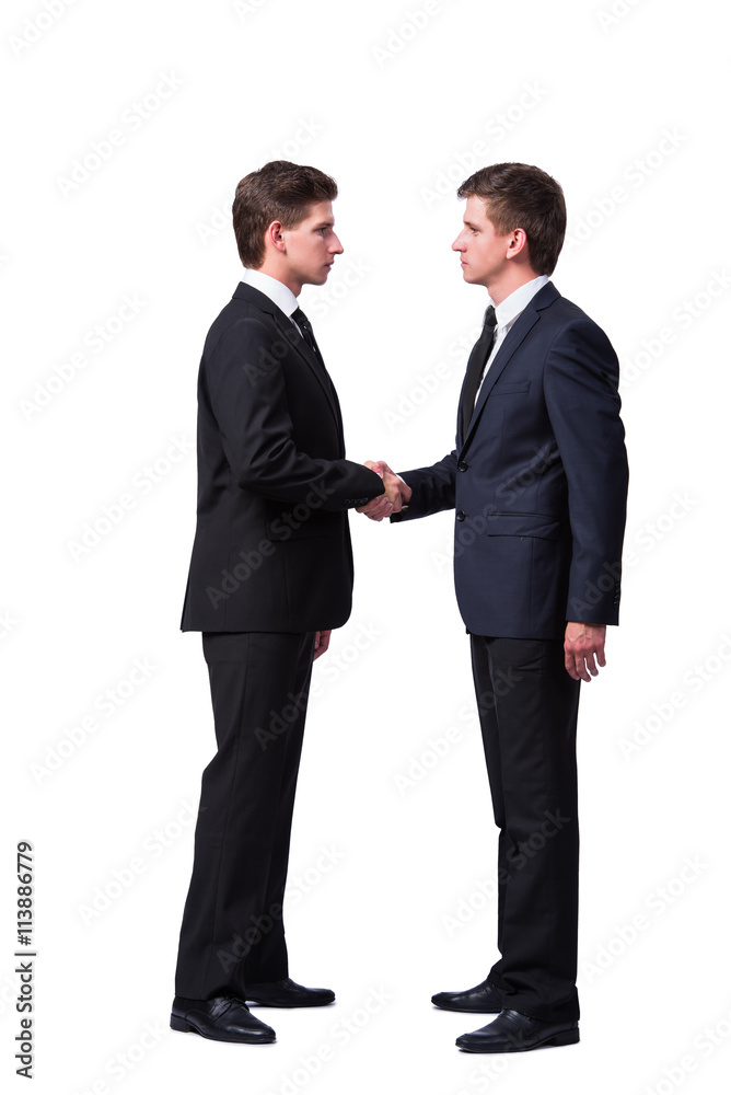 Two twin brothers handshaking isolated on white Two twin brothers handshaking isolated on white