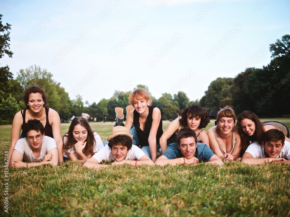 large group of friends tohether in a park having fun large group of friends tohether in a park having fun