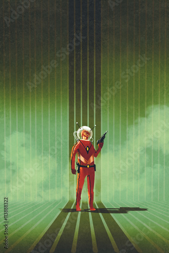 Foto super hero in red suit holding gun over green background,vintage style,illustrat