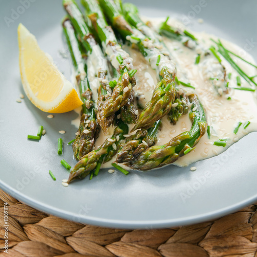 green asparagus in lemon sauce photo