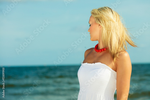 Young lady on sunny beach.