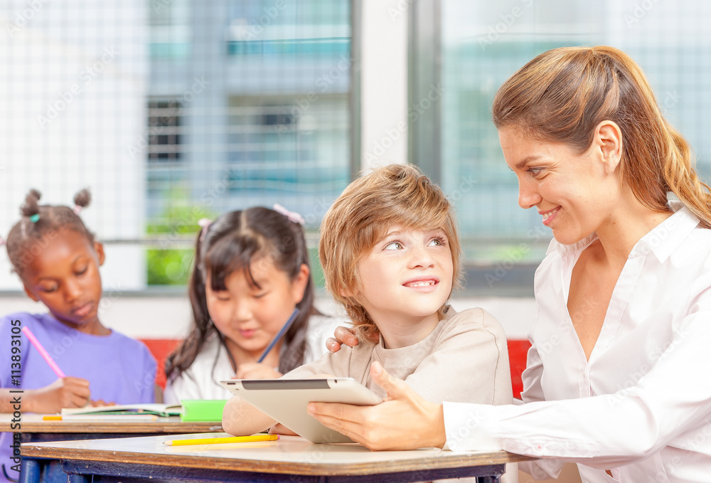 Beautiful teacher with mixed race classroom Beautiful teacher with mixed race classroom