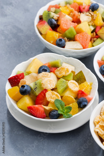 assortment of fresh fruit salads, vertical