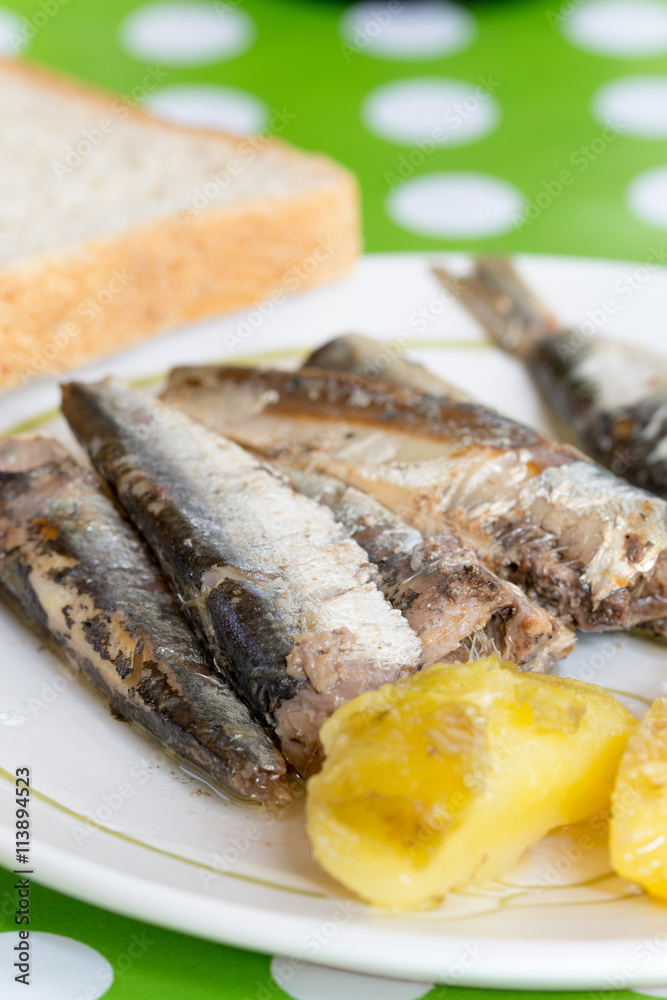 Marinated sardines served with potatoes