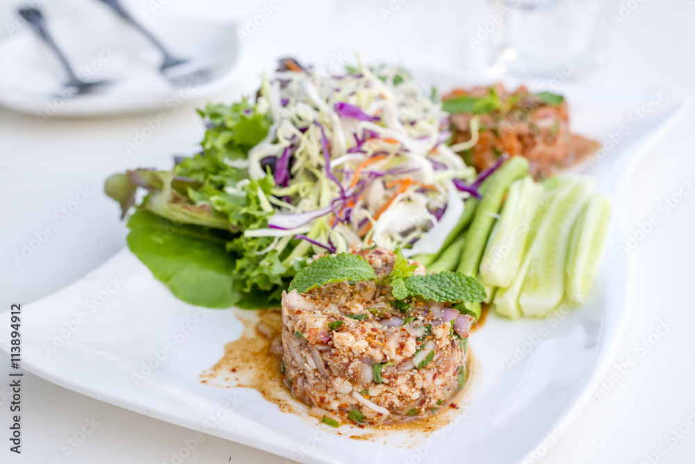 Spicy pork salad with vegetables and chillies what we called Larb Moo in Thai style local the northeastern delicious food of Thailand.