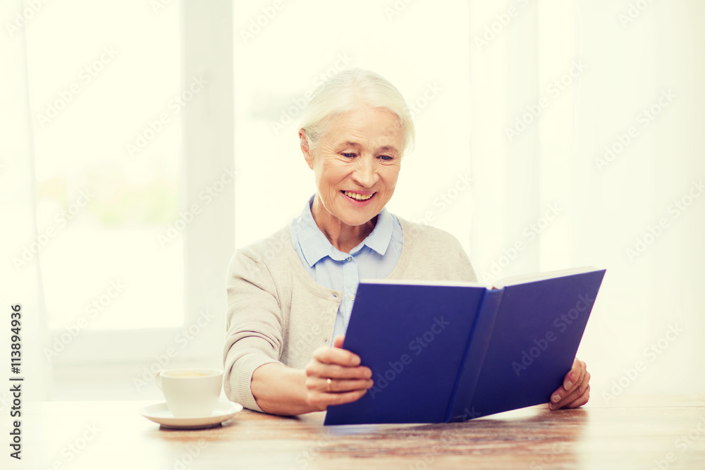 happy smiling senior woman reading book at home happy smiling senior woman reading book at home