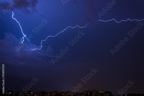 Lightnings above the city in a summer night