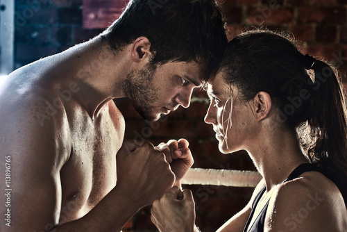 man woman training gym boxing mma ring pads mixed martial arts f