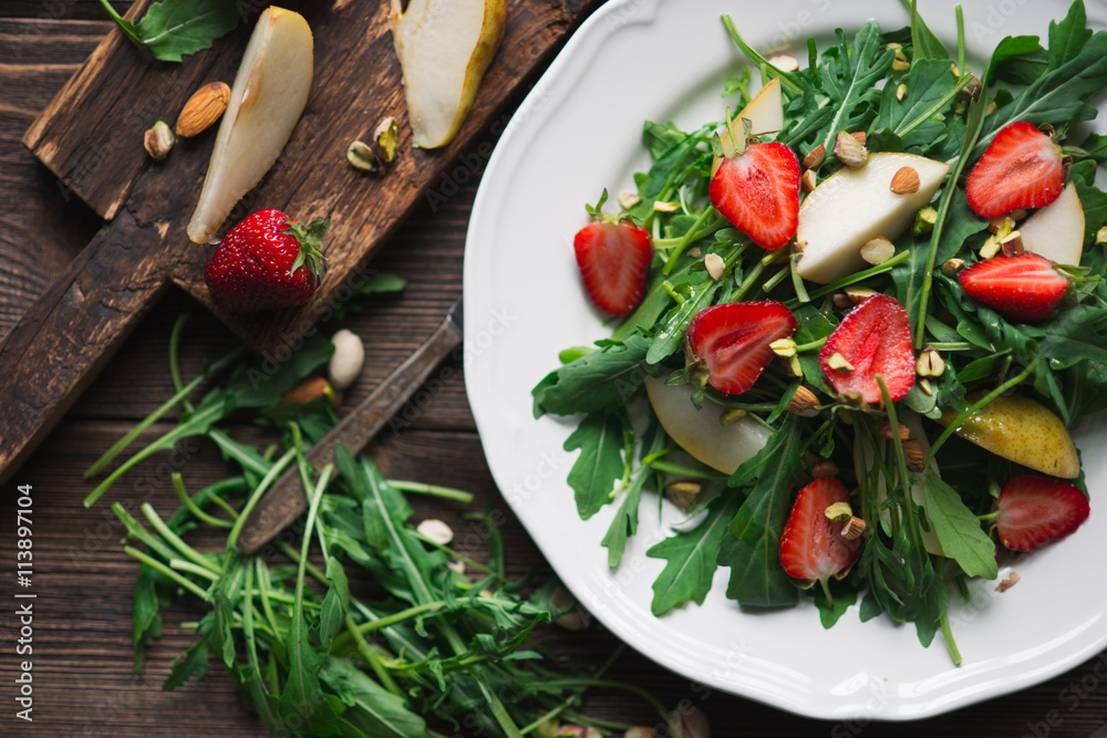 Salad with strawberry, arugula and pear Salad with strawberry, arugula and pear