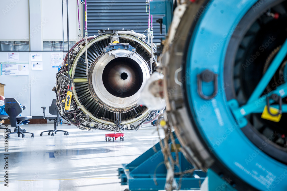 Engine's maintenance in huge industrial hall
