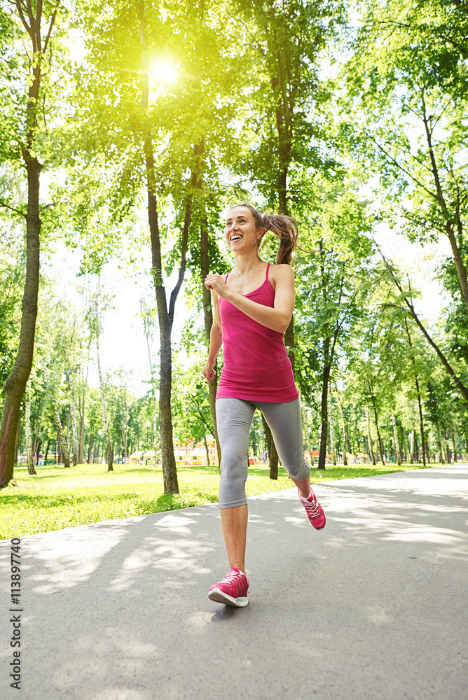  Graceful sporty woman jogging in the park