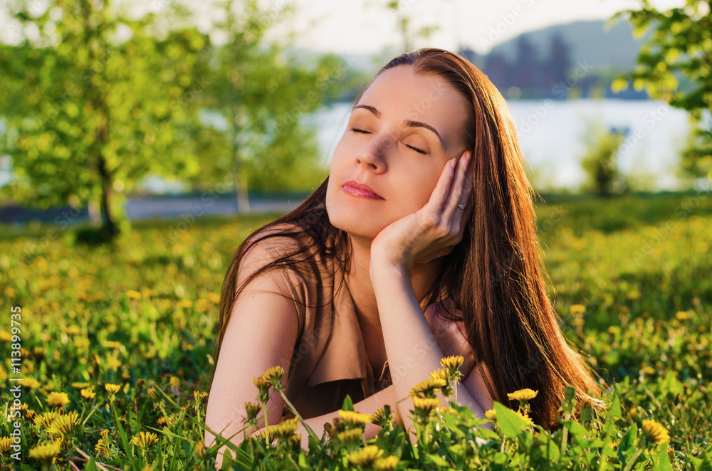 beautiful woman dreams of in the summer Park beautiful woman dreams of in the summer Park