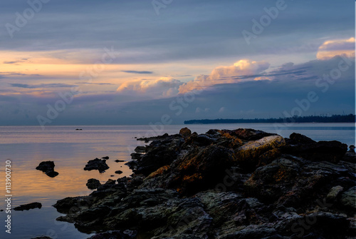 Stones in the sea at beautiful dusk sunrise