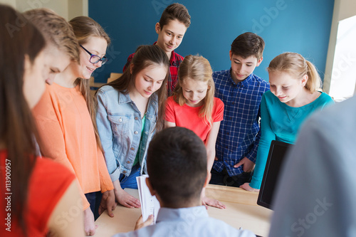 group of students and teacher at school classroom