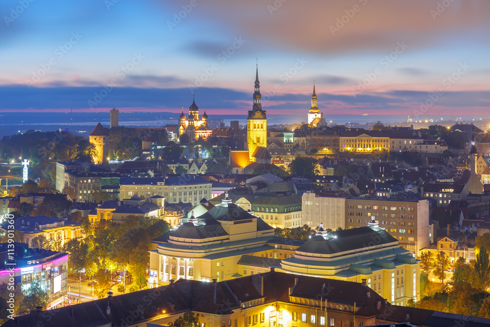 Night aerial cityscape with Medieval Old Town illuminated with Saint Nicholas Church, Cathedral Church of Saint Mary and Alexander Nevsky Cathedral in Tallinn, Estonia