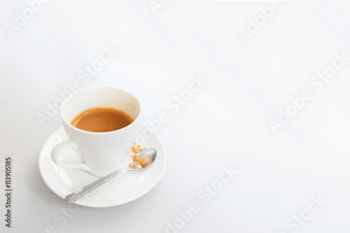 White cup of coffee on white wood table