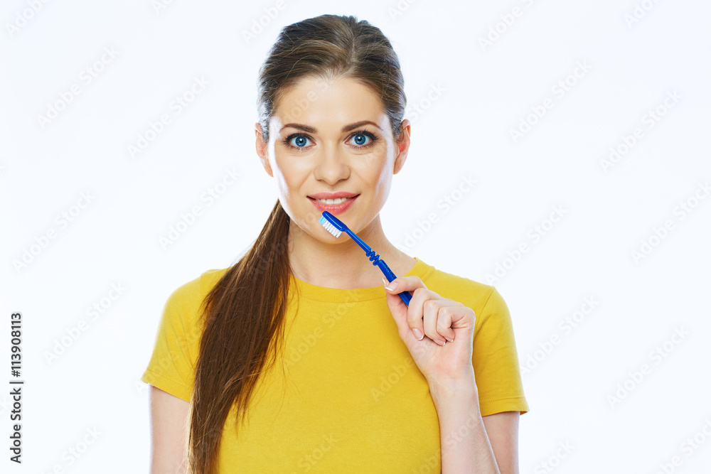 Smiling woman holding toothy brush. Isolated studio portrait. Smiling woman holding toothy brush. Isolated studio portrait.
