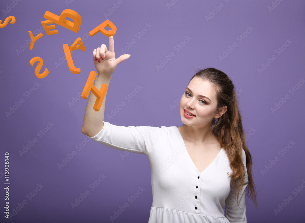 Woman working with a set of letters, writing concept. Woman working with a set of letters, writing concept.