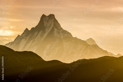Himalayan mountain peak during sunrise ( Machapuchare or Fishtail peak in Nepal ) photo