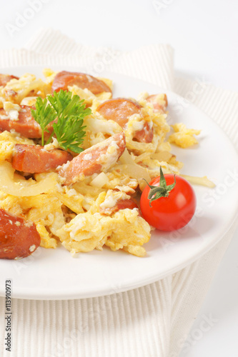 scrambled eggs with sliced sausage