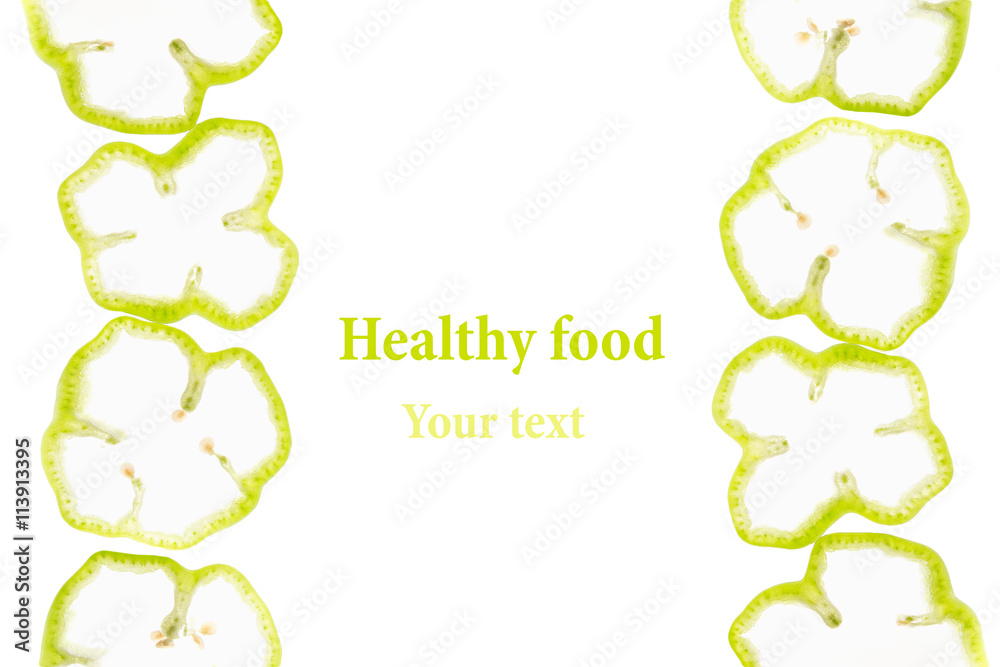 Sliced green pepper rings paprika on a white background. Decorative frame of pepper. Isolated. Food background. Concept art. Copy space. Sliced green pepper rings paprika on a white background. Decorative frame of pepper. Isolated. Food background. Concept art. Copy space.