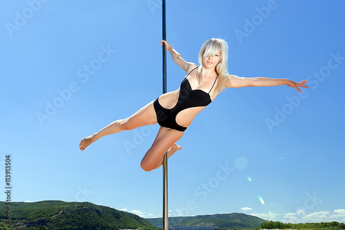 blonde in bathing suit on pole for dancing